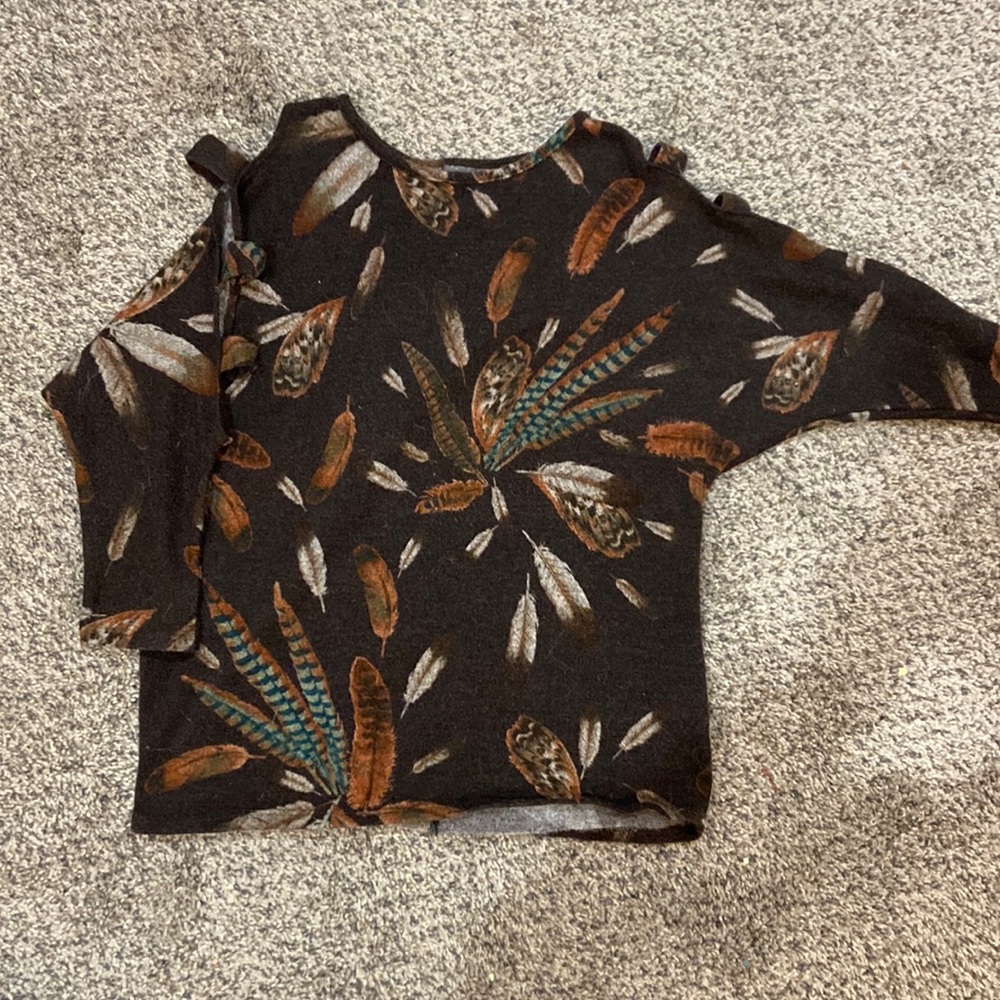 Woman’s open shoulder sweater